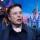 Composite image of Elon Musk against Disney castle background, symbolizing the corporate showdown between X and Disney